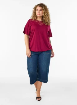 Bluse mit Spitzeneinsatz und Ballonärmeln
