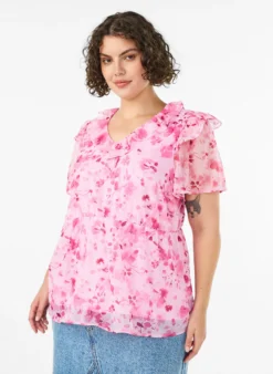 Geblümte Bluse mit Rüschenkragen und Peplum-Effekt