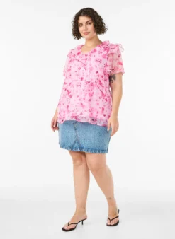 Geblümte Bluse mit Rüschenkragen und Peplum-Effekt