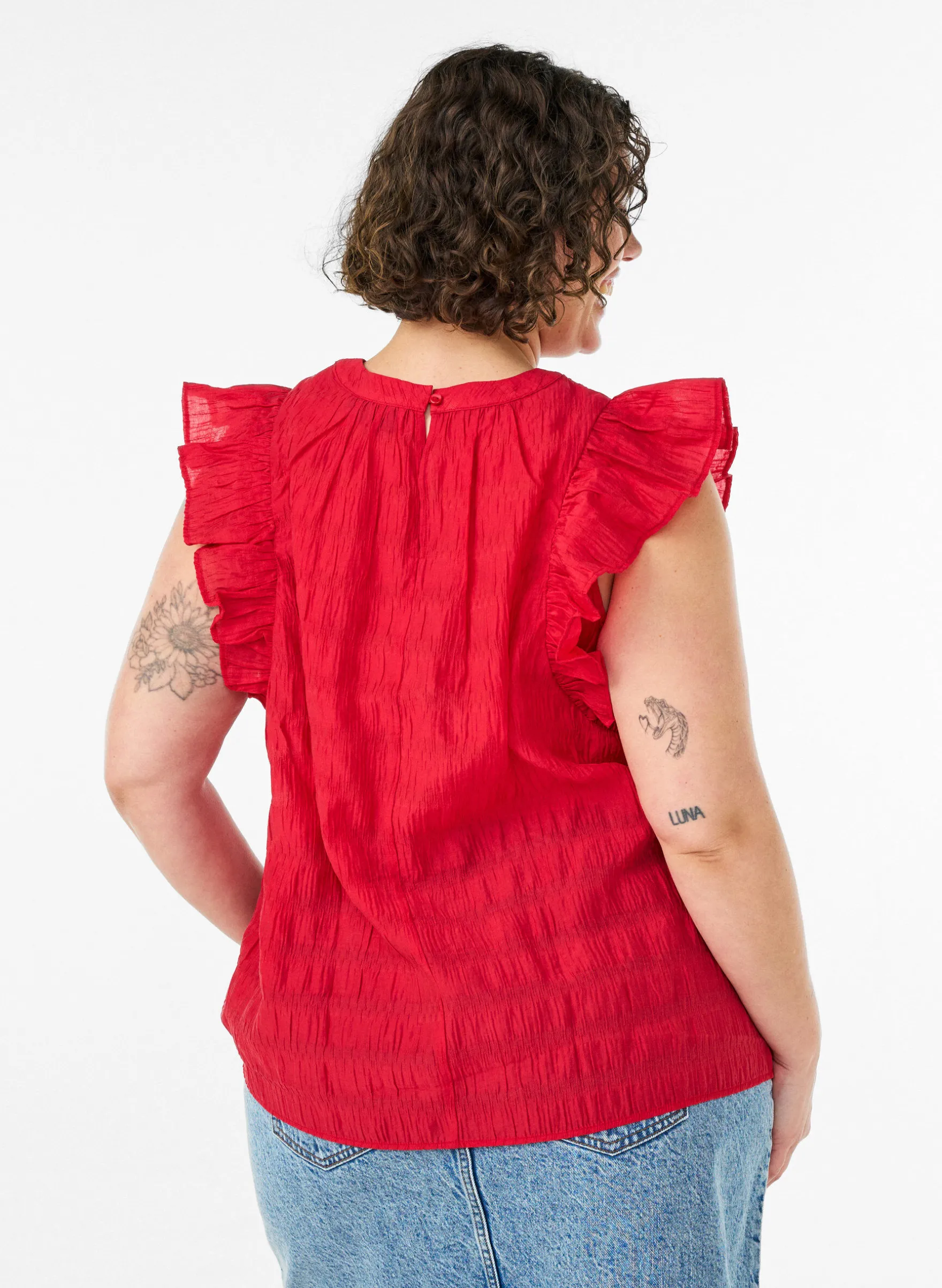 Ärmellose Bluse mit Struktur und Rüschen