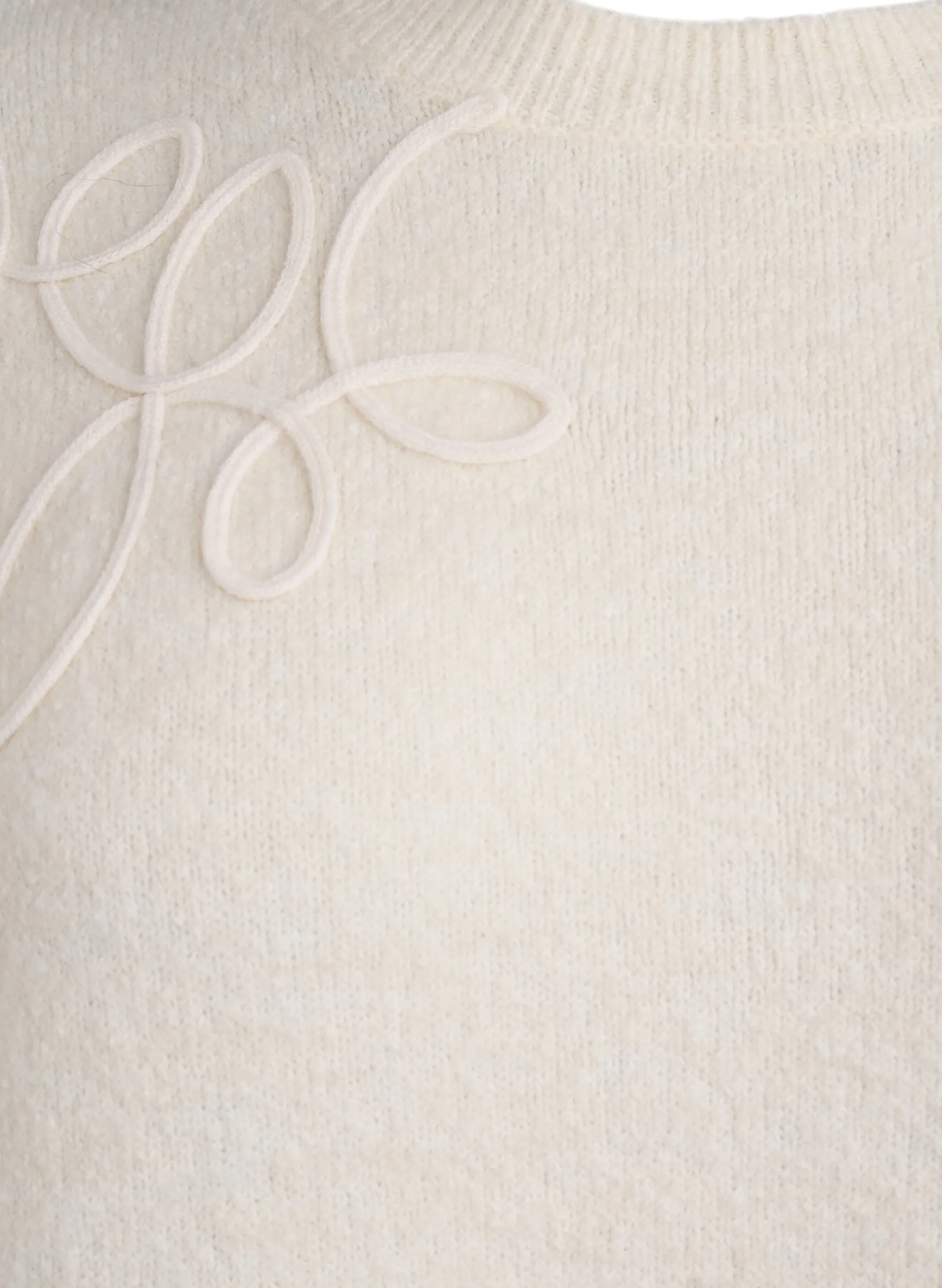 Strickbluse mit aufgenähten Kordeldetails