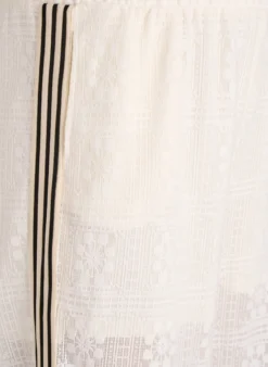 Weite Spitzenhose mit Kontraststreifen